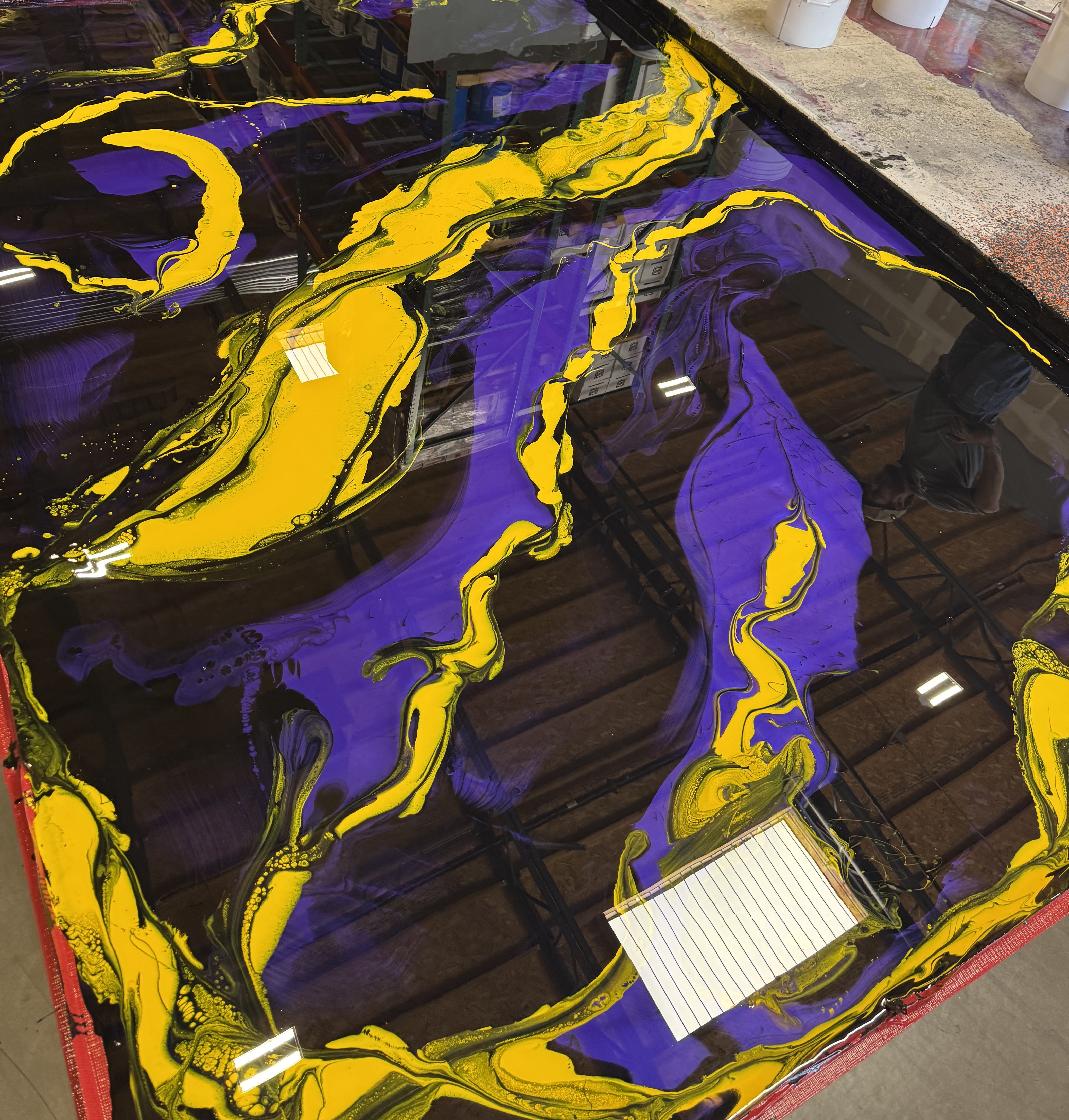 Purple and gold swirled metallic epoxy coating application in Las Vegas, NV